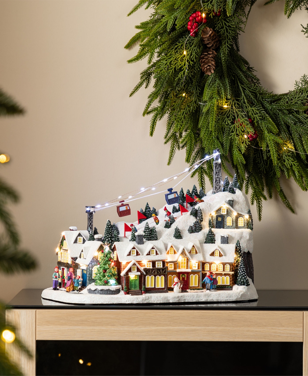 Glitzhome 16" Christmas Oversized Resin Lighted Musical Skiing Village In Multi