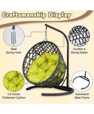 This rattan cat swing bed with cushion and stand provides a cozy swinging space for cats and small pets offering comfort and relaxation indoors