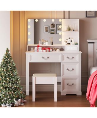 Vanity desk for bedroom with lights, drawers, shelves, stool, and mirror.