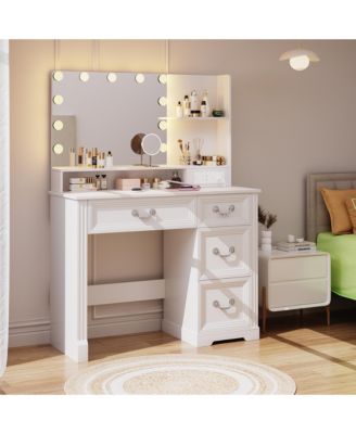 Vanity desk for bedroom with lights, drawers, shelves, stool, and mirror.