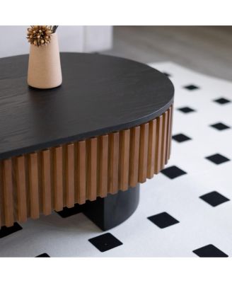 Elliptical coffee table with storage