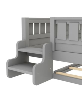 Full bed with bookshelves, staircase, safety rails, trundle