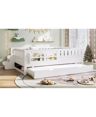 Full bed with bookshelves, staircase, safety rails, and trundle