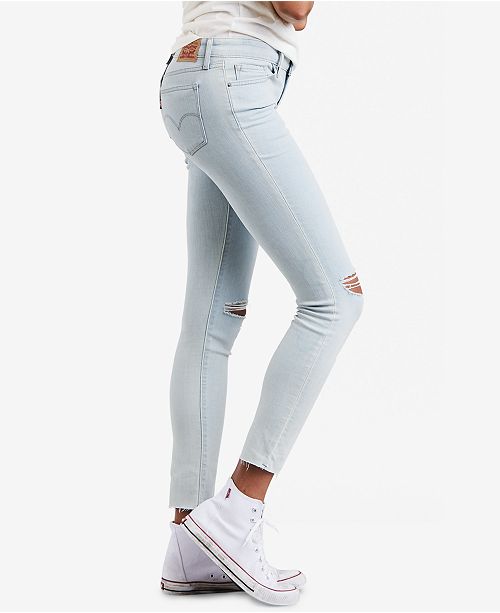 White ripped levis