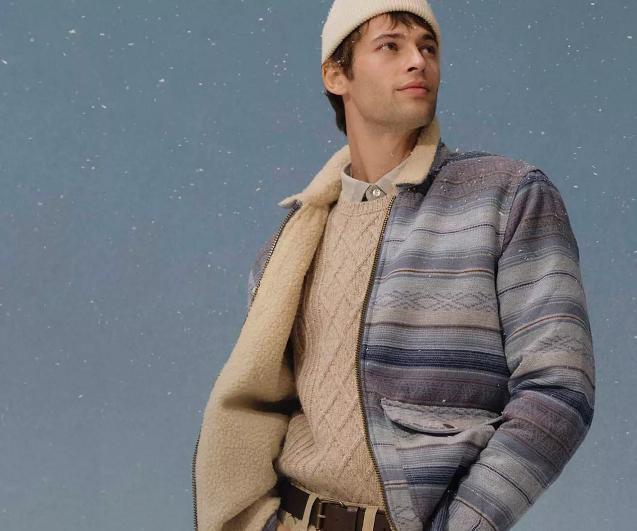 Man attired in winter apparel with scarf and winter hat