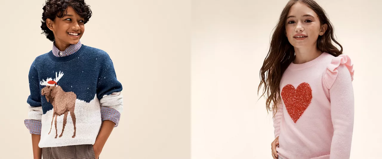 Kids clothing, boy on the left and girl on the right with decorative apparel.