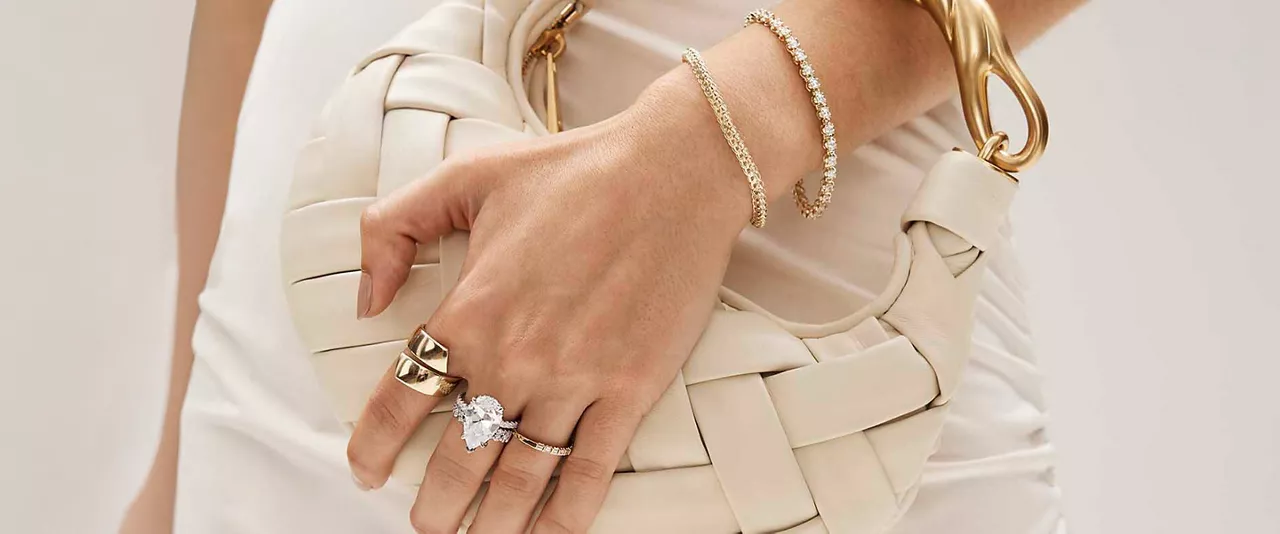 Woman's hand and wrist wearing rings, and bracelets