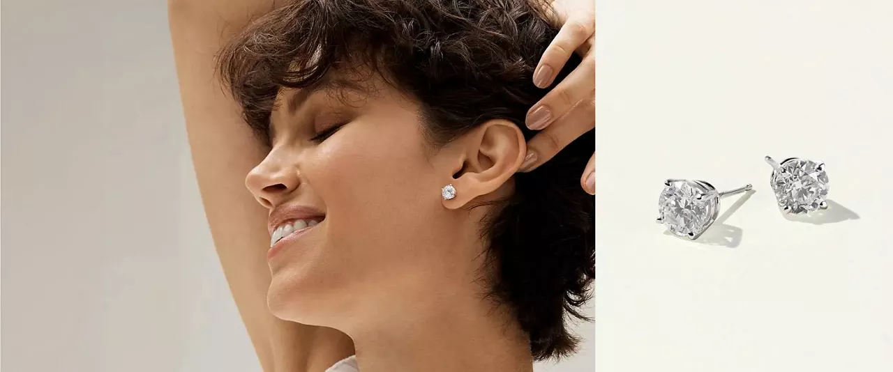 woman wearing diamond earrings