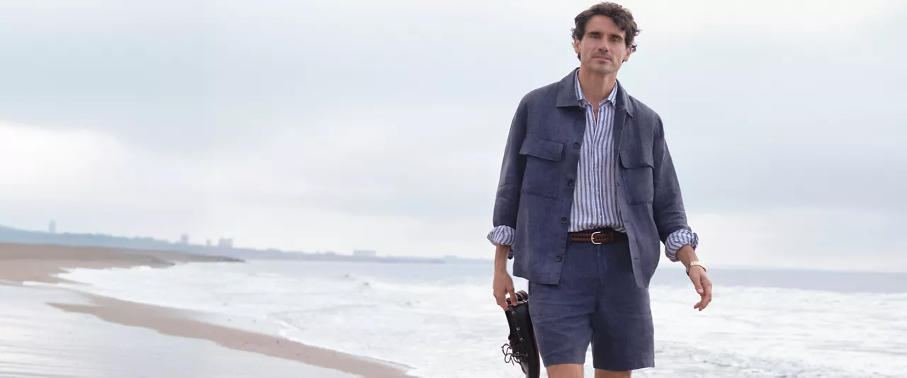 man wearing linen on beach