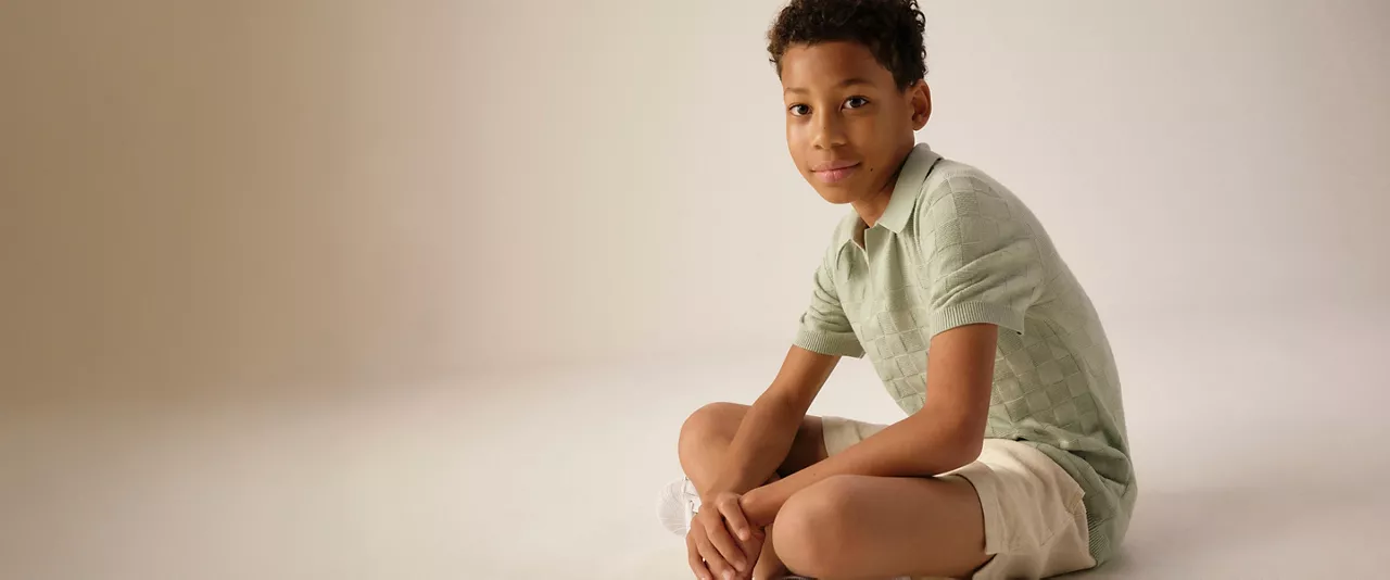 kid in polo shirt